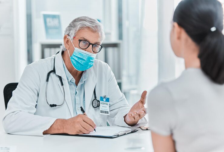 any headaches shot mature doctor wearing face mask sitting with his patient consultation his clinic 590464 66711