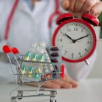 healthcare-professional-holding-clock-shopping-cart-filled-with-medicine_587895-7698.jpg