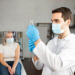 medium-shot-doctor-preparing-vaccine_23-2148816243.jpg